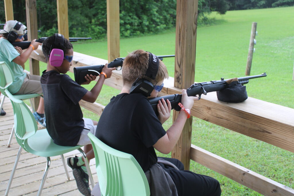 youth at rifle range at summer camp